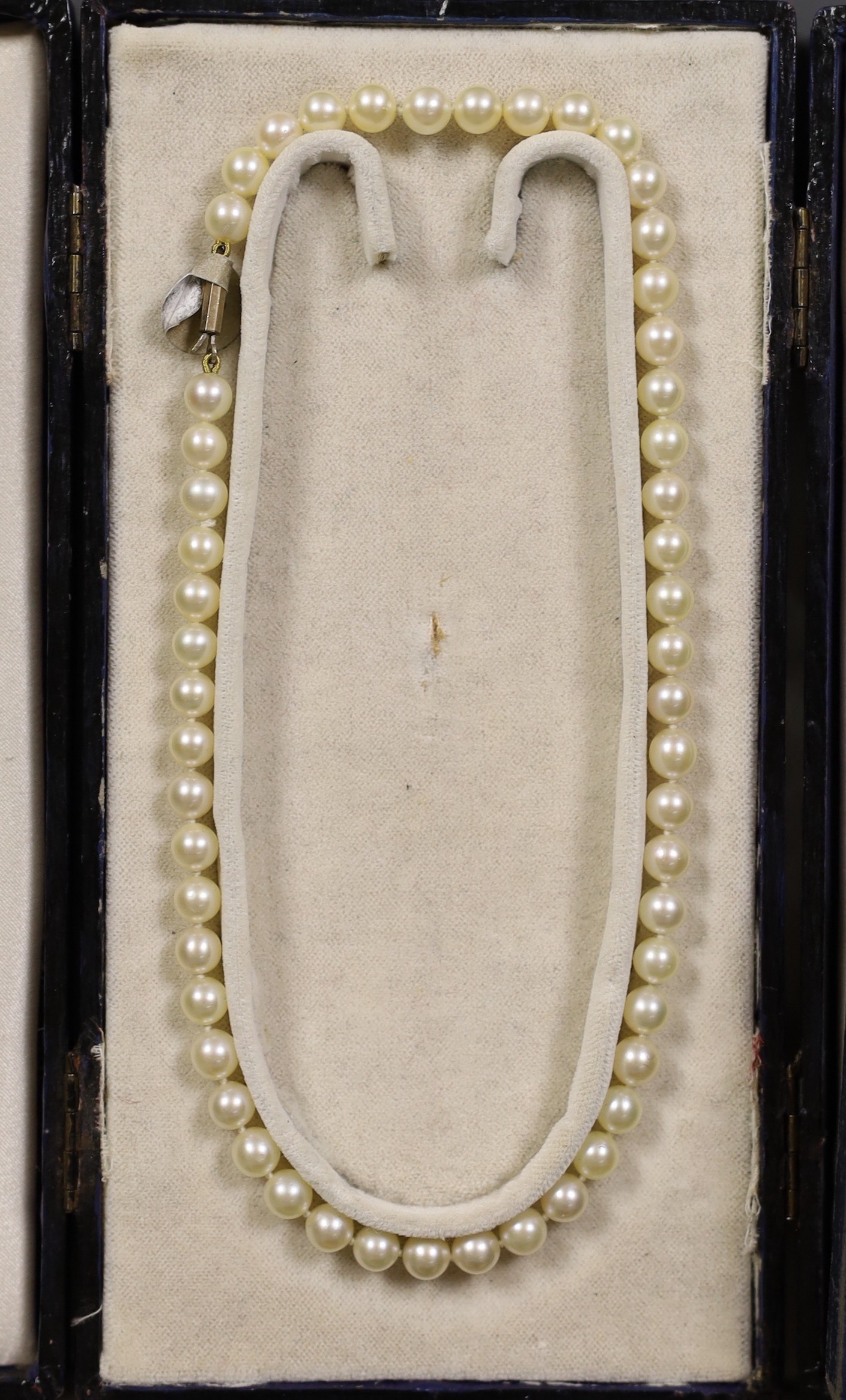 Four assorted cased single strand cultured pearl necklaces, with yellow metal or sterling clasps, longest 48cm.